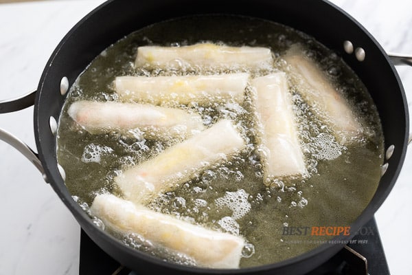 Cooking egg rolls in a hot oil