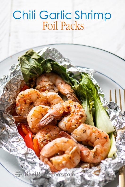 Chili Garlic Shrimp Foil Packs Dinners Healthy Seafood Foil Pack from on a plate 