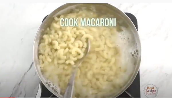 Cook macaroni in pot of boiling water