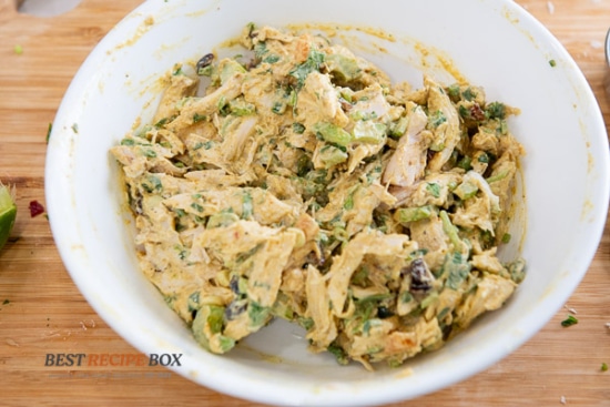 bowl of stirred curry chicken salad