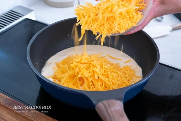 melting cheese into evaporated milk