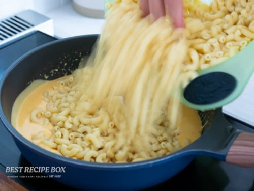 adding cooked macaroni