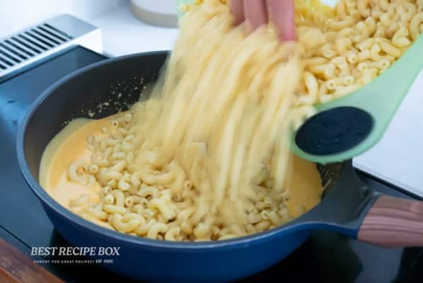 adding cooked macaroni
