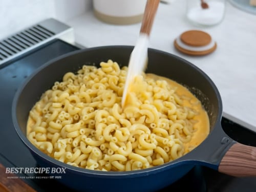 stirring mac and cheese