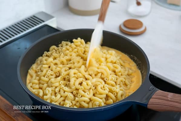 stirring mac and cheese