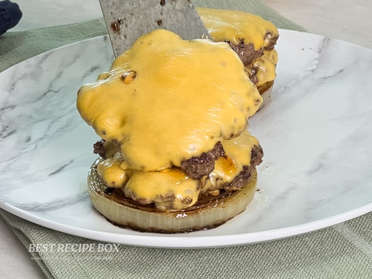 adding 2 patties on onion