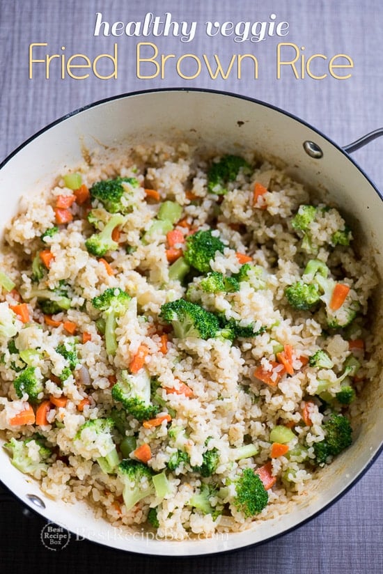 Healthy fried brown rice recipe with vegetables in cool pot