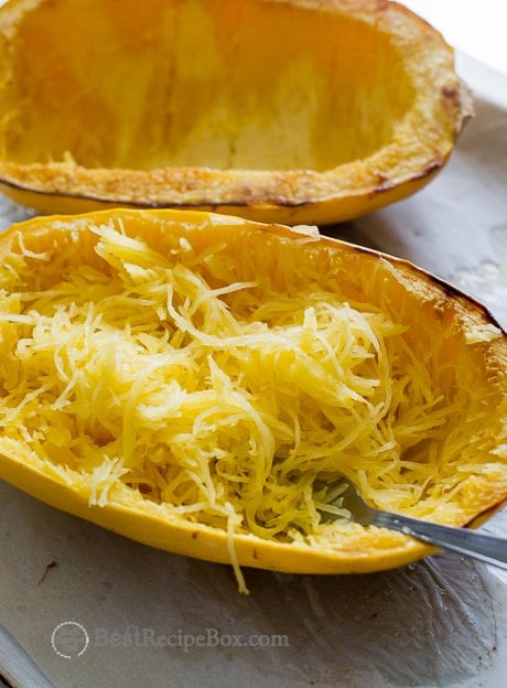 How to Roast Spaghetti Squash on a cutting board with fork