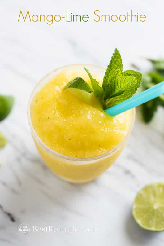 Refreshing Mango Lime Smoothie Recipe in a glass with a straw