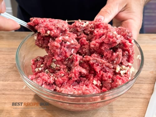 beef burger mix with seasonings in bowl