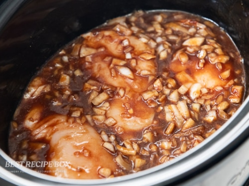 chicken pushed down in sauce