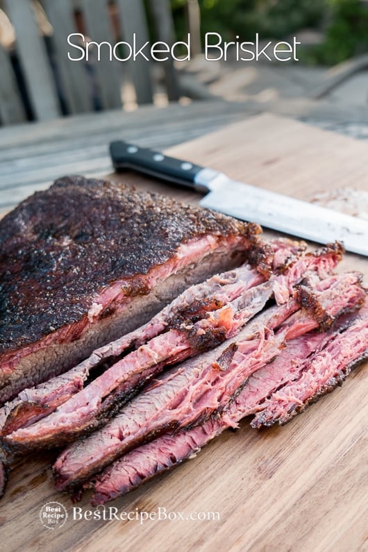 Smoked Brisket Recipe and Best Biscuit Recipe on a cutting board 