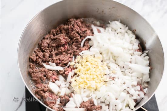 Brown meat with chopped onions and garlic