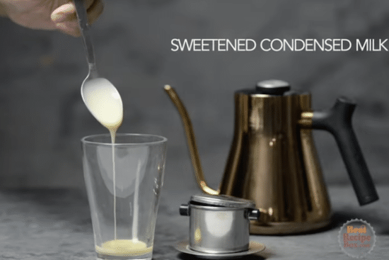Pouring sweetened condensed milk into a glass