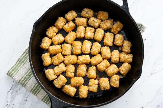Cooked tater tots in a casserole