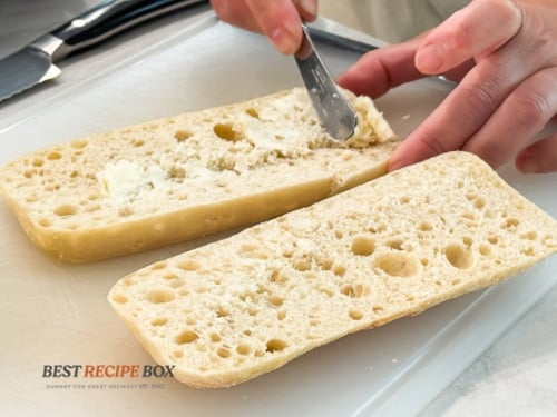 spreading butter on bread