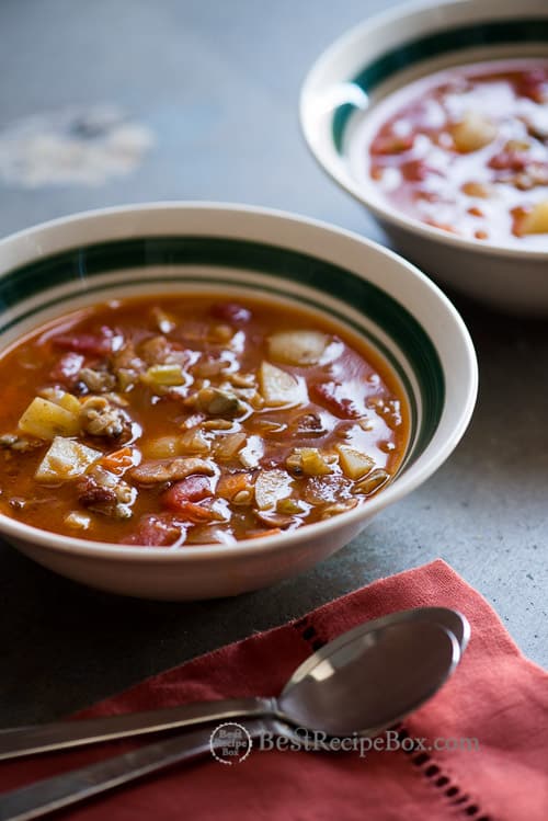 30 minute Manhattan Clam Chowder Recipe in a bowl with spoon